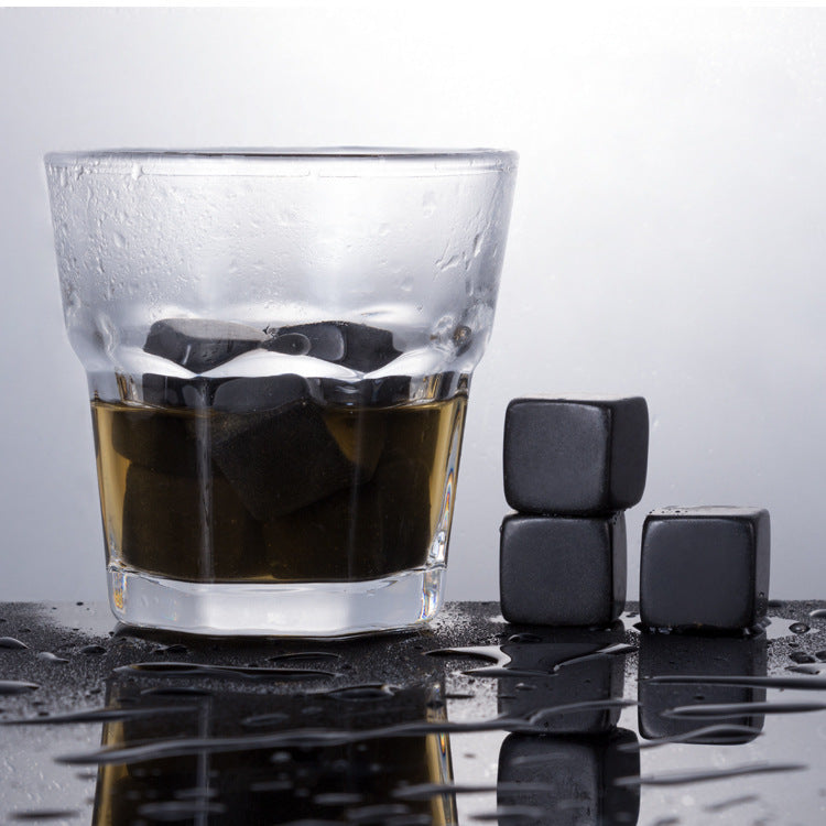 A wooden box for whiskey glass marble ice cubes