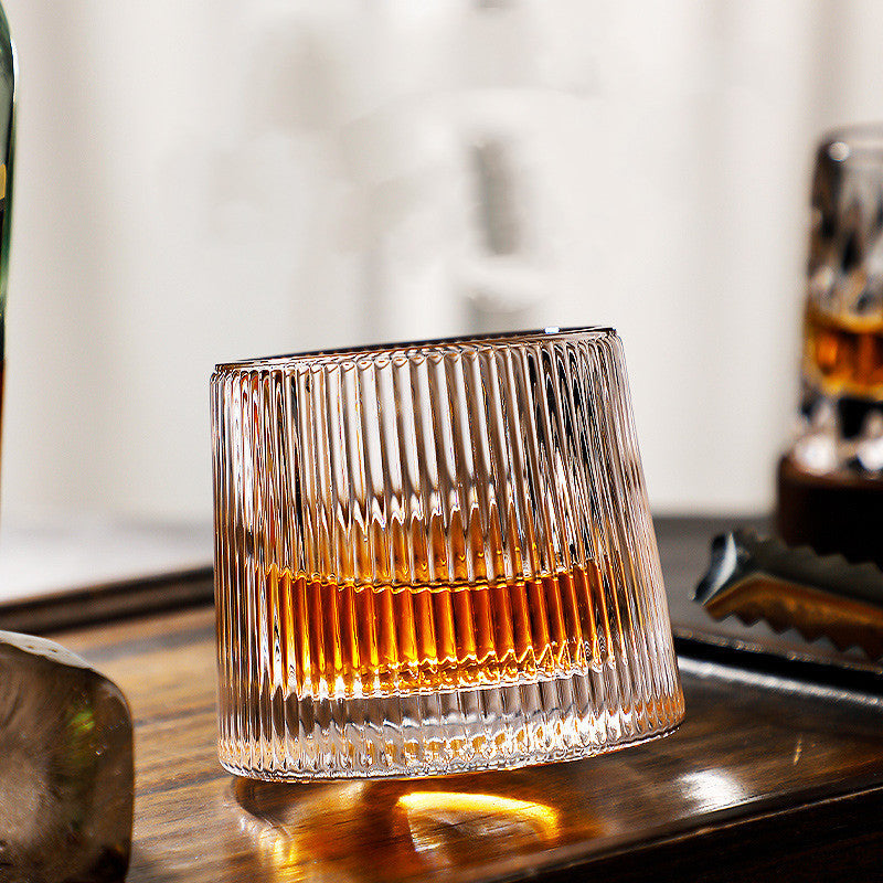 Thickened rotating tumbler whiskey glass