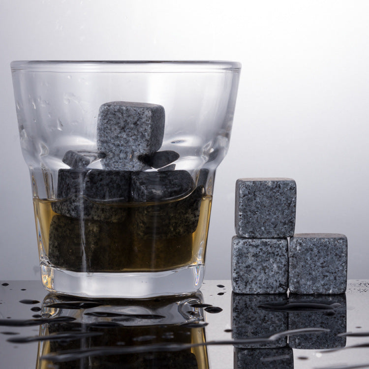 A wooden box for whiskey glass marble ice cubes