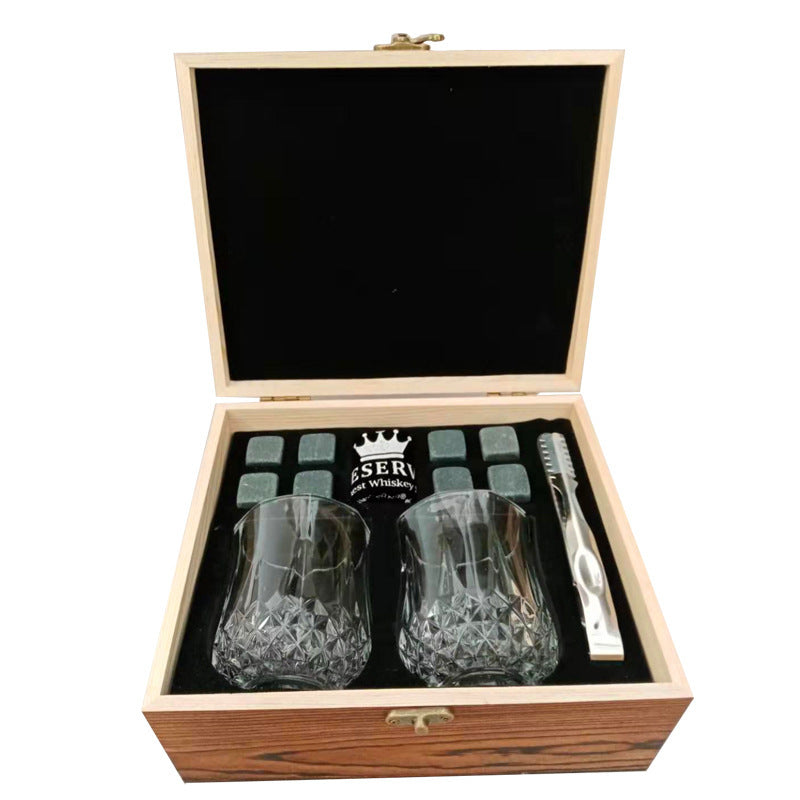 A wooden box for whiskey glass marble ice cubes